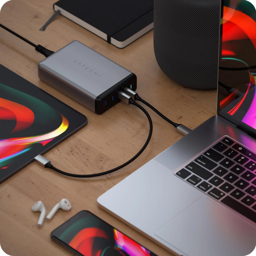 Satechi 108w pro usb-c pd desktop wall charging a MacBook Pro, an iPhone, and a iPad Pro