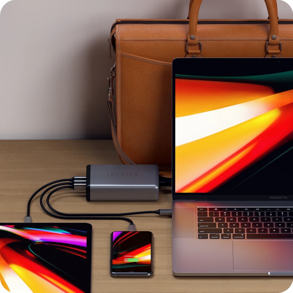 Satechi 108W pro usb-c pd desktop wall charger on a desk charging a MacBook Pro and iPad